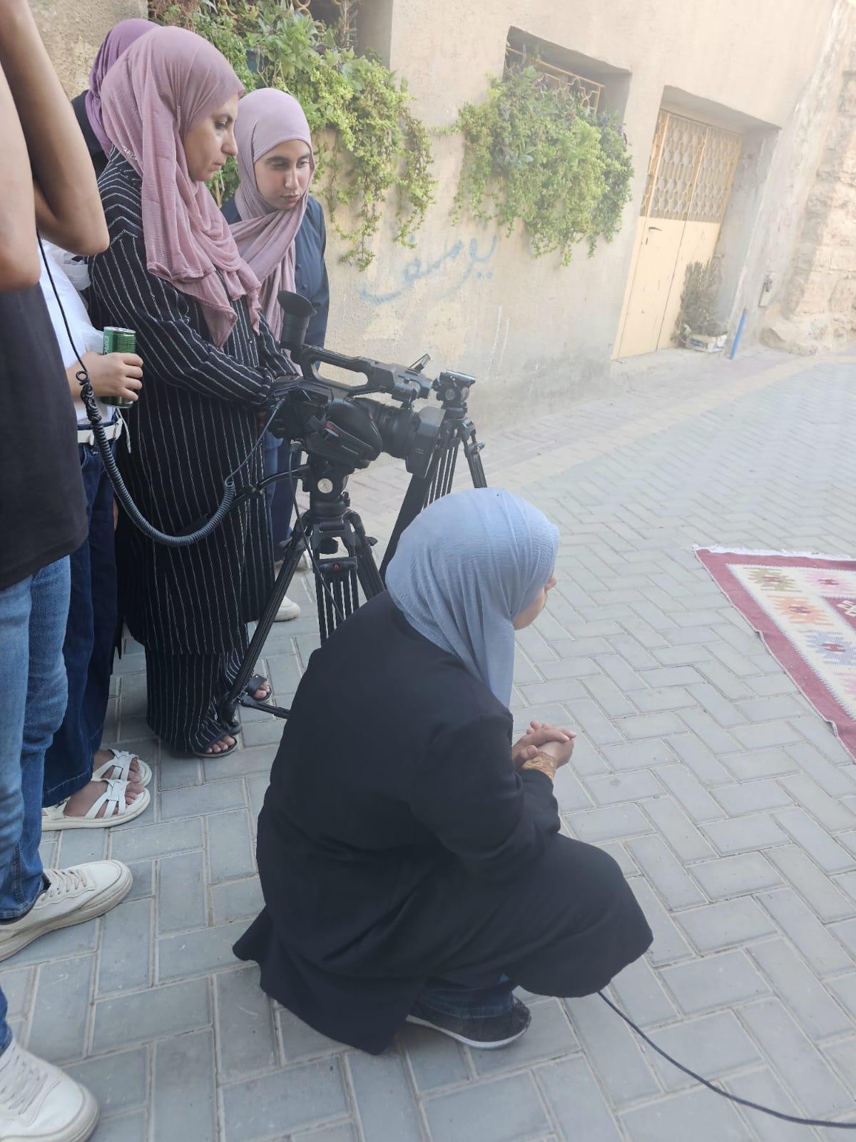 A participatory-video crew filming in an Old City alley