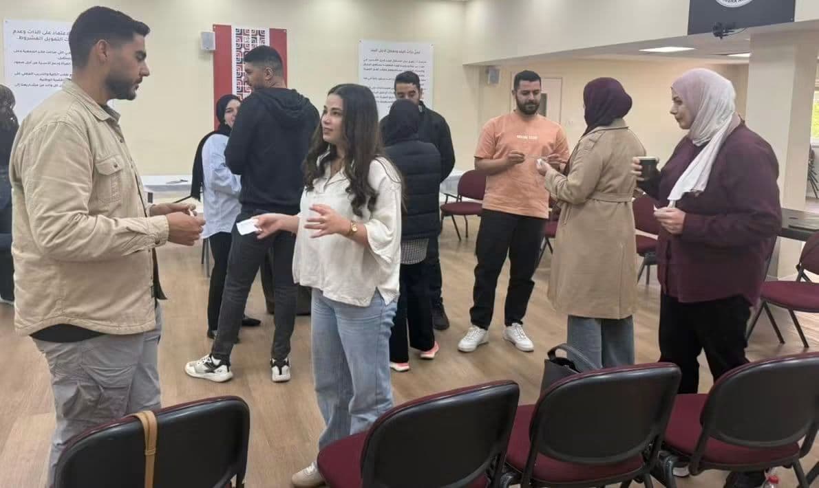 Participants networking during a break at a MEND event