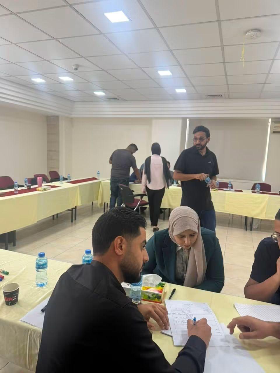Participants taking notes at a training workshop